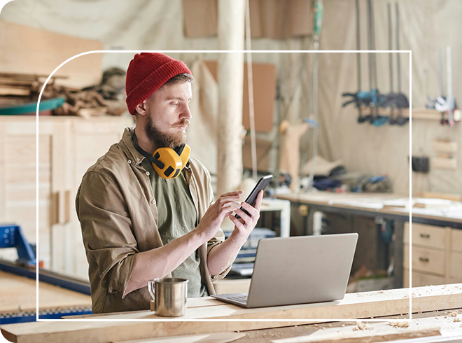 Tradesperson making a payment on their mobile